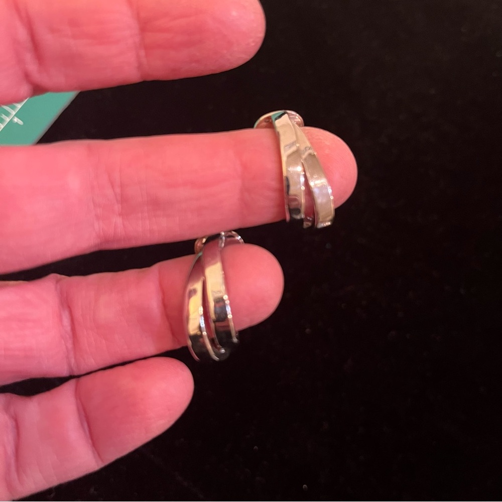 Vintage silver tone double loop smooth clip on earrings.